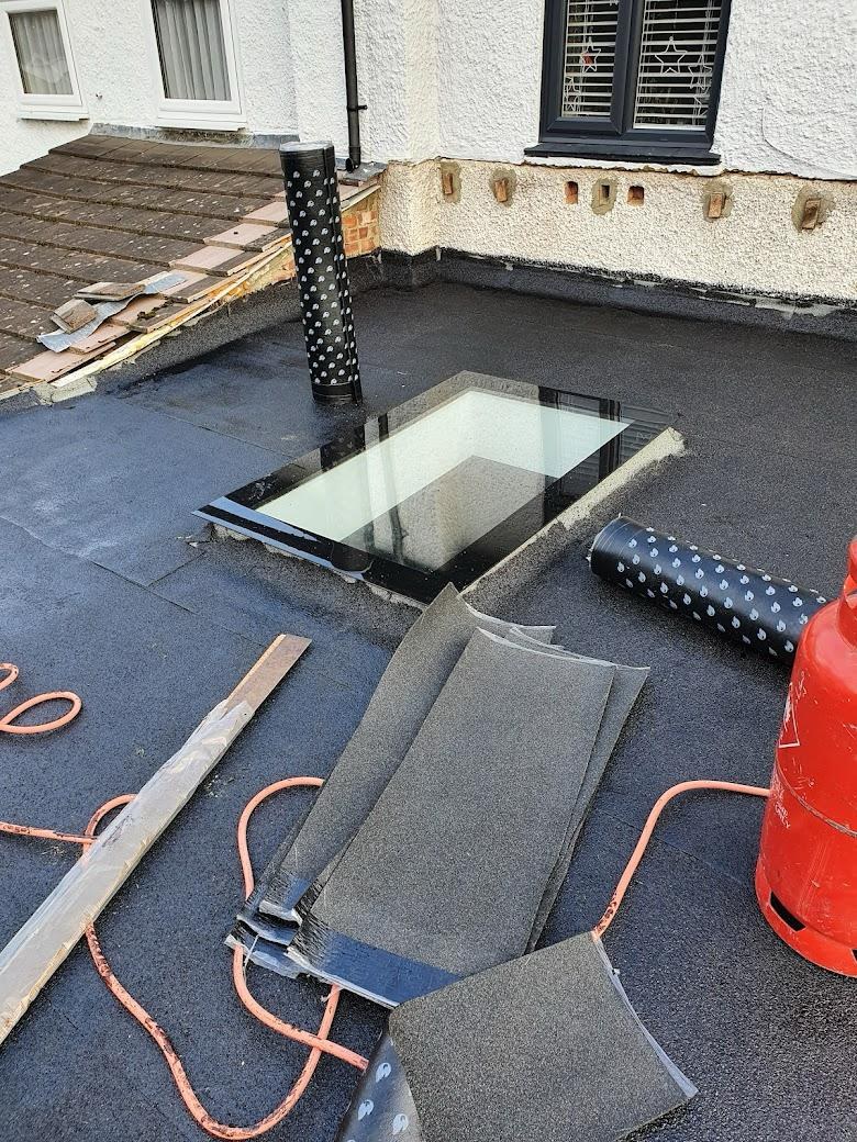 Torch on felt flat roof near Velux in Tipperary