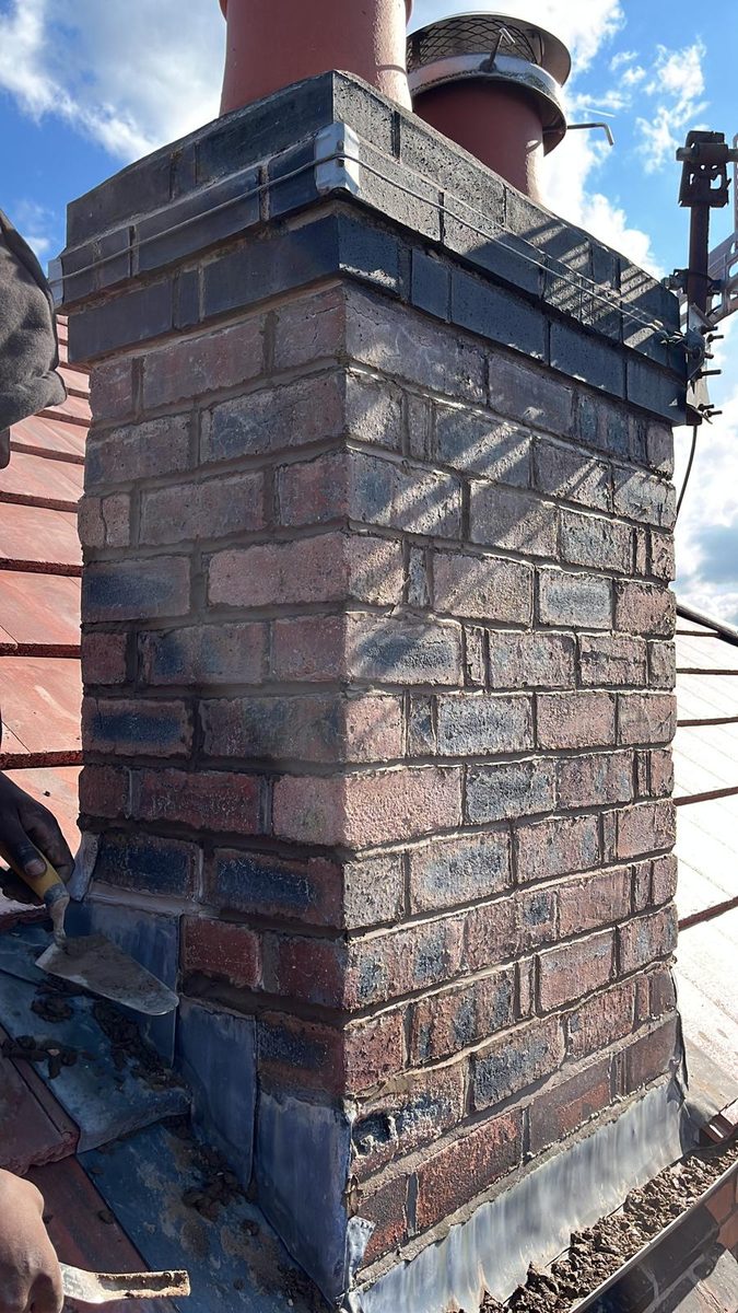 Chimney repointing and flashing repair in Ennis