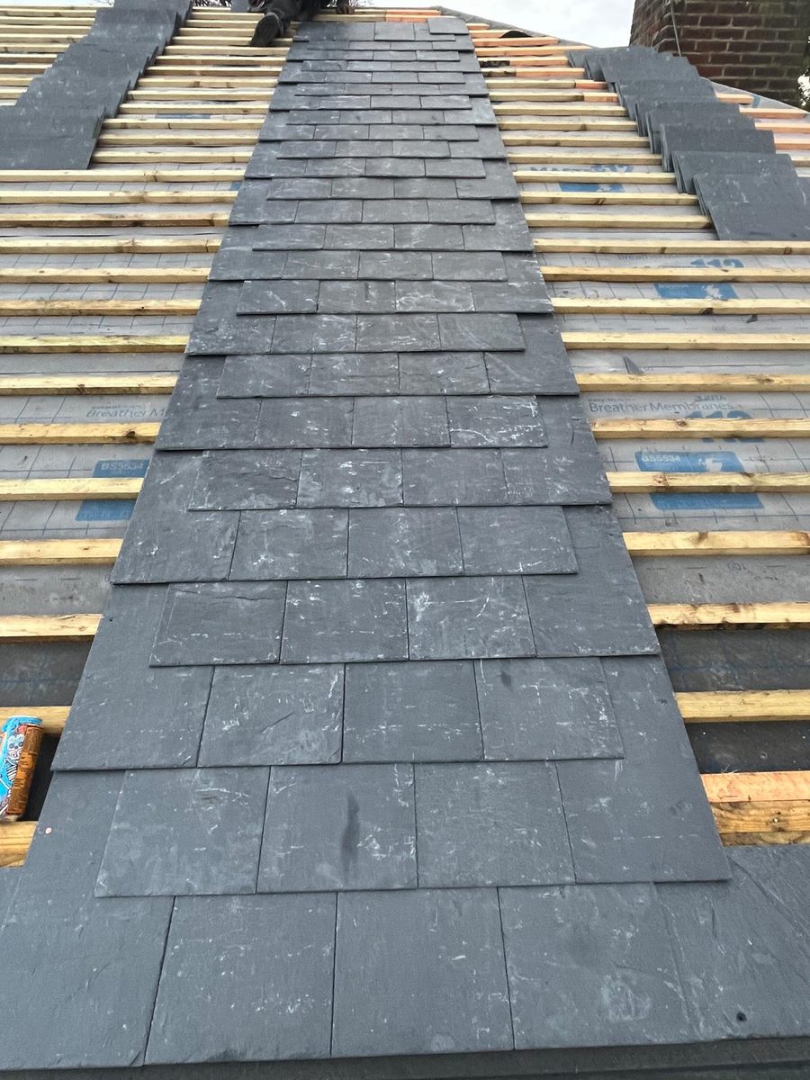 Slate roof installation in progress